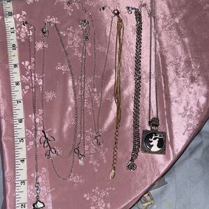 A lot of fashion necklaces, and one bracelet